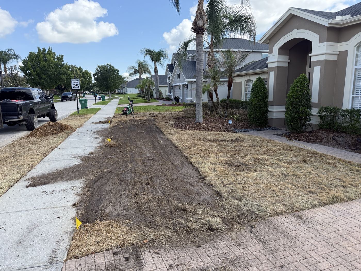 Sod cutter removing the dead lawn in strips